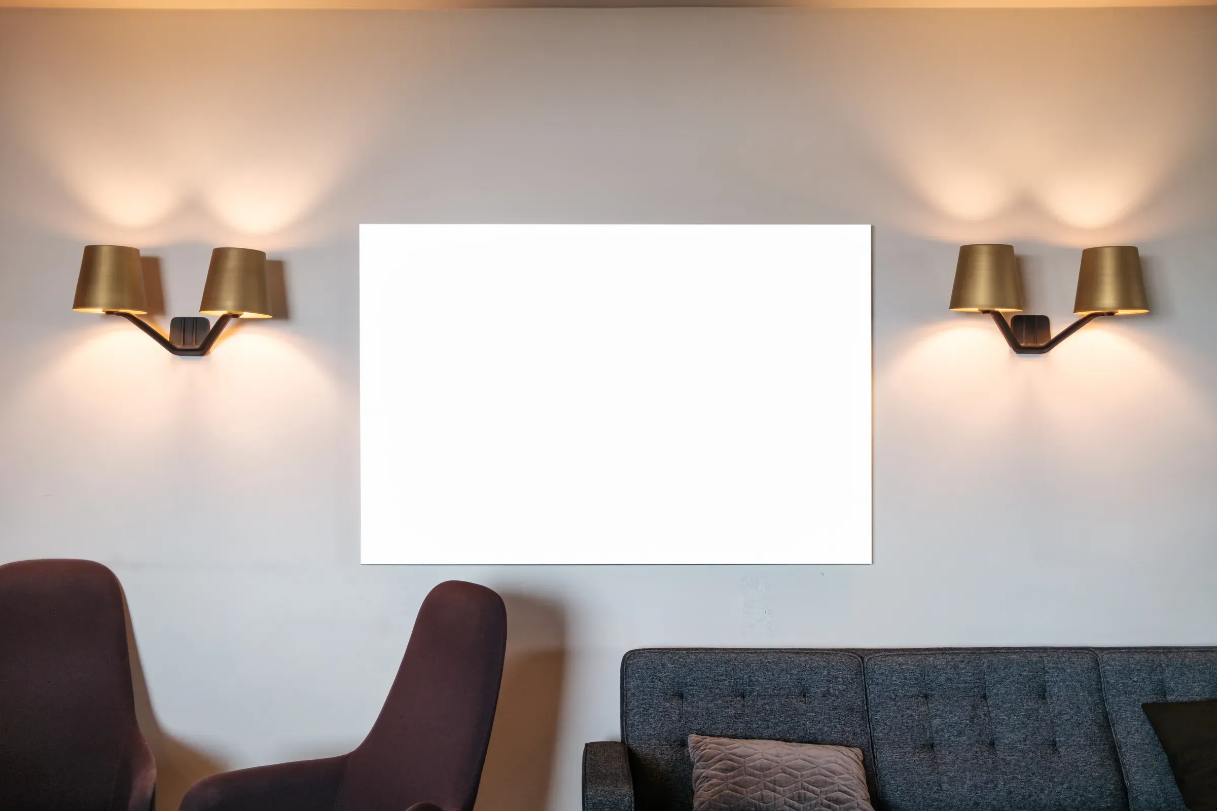 Scandinavian living room with blank white wall art, warm lighting and modern furniture, art prints & posters ecommerce