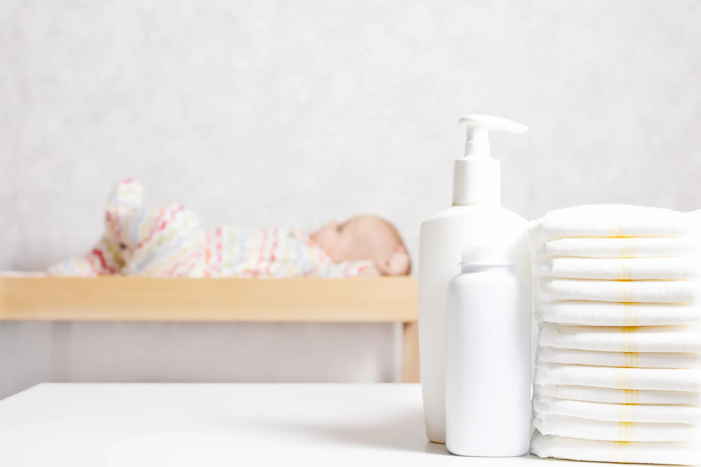 Baby care products on table. Close up, baby & kids ecommerce