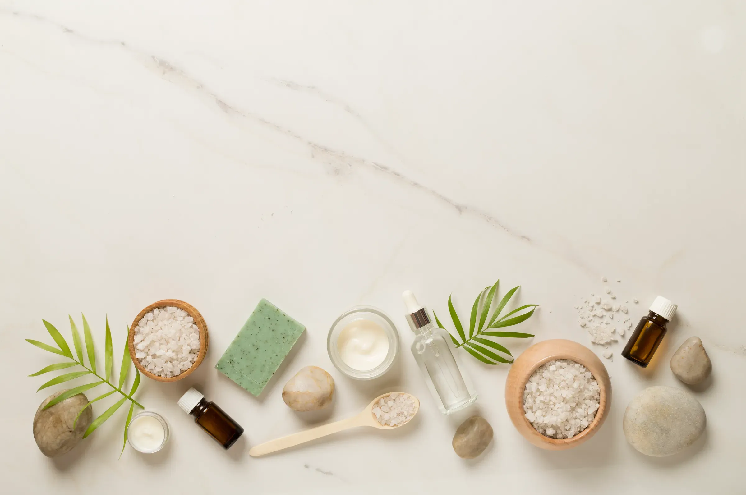 Composition with spa products on marble background, top view, beauty & skincare ecommerce