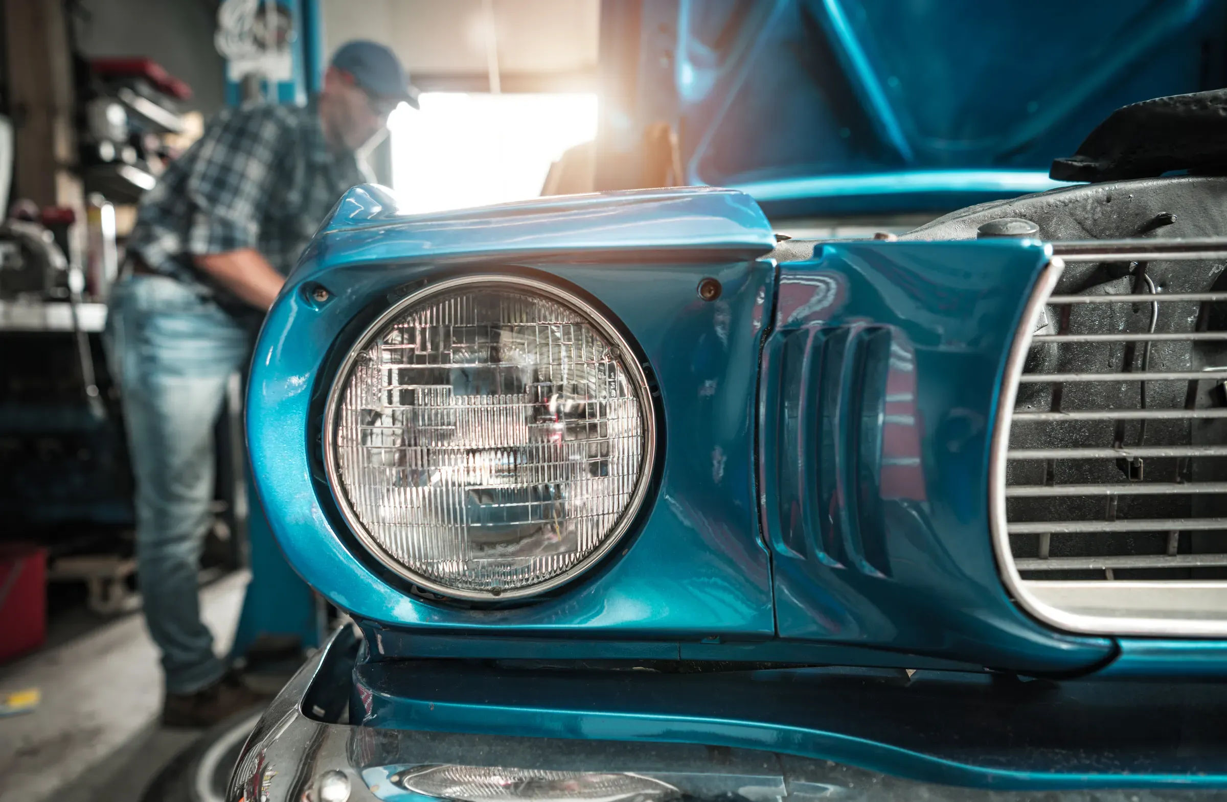 Classic Cars Restoration Worker Next to His Restored Vehicle, classic car parts ecommerce