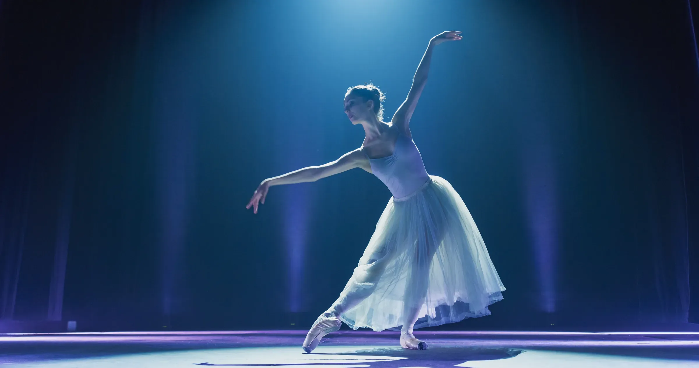 Cinematic Shot of Ballerina in Pointe Shoes and White Tutu Dancing and Rehearsing on Classic Theatre Stage, dance shoes ecommerce