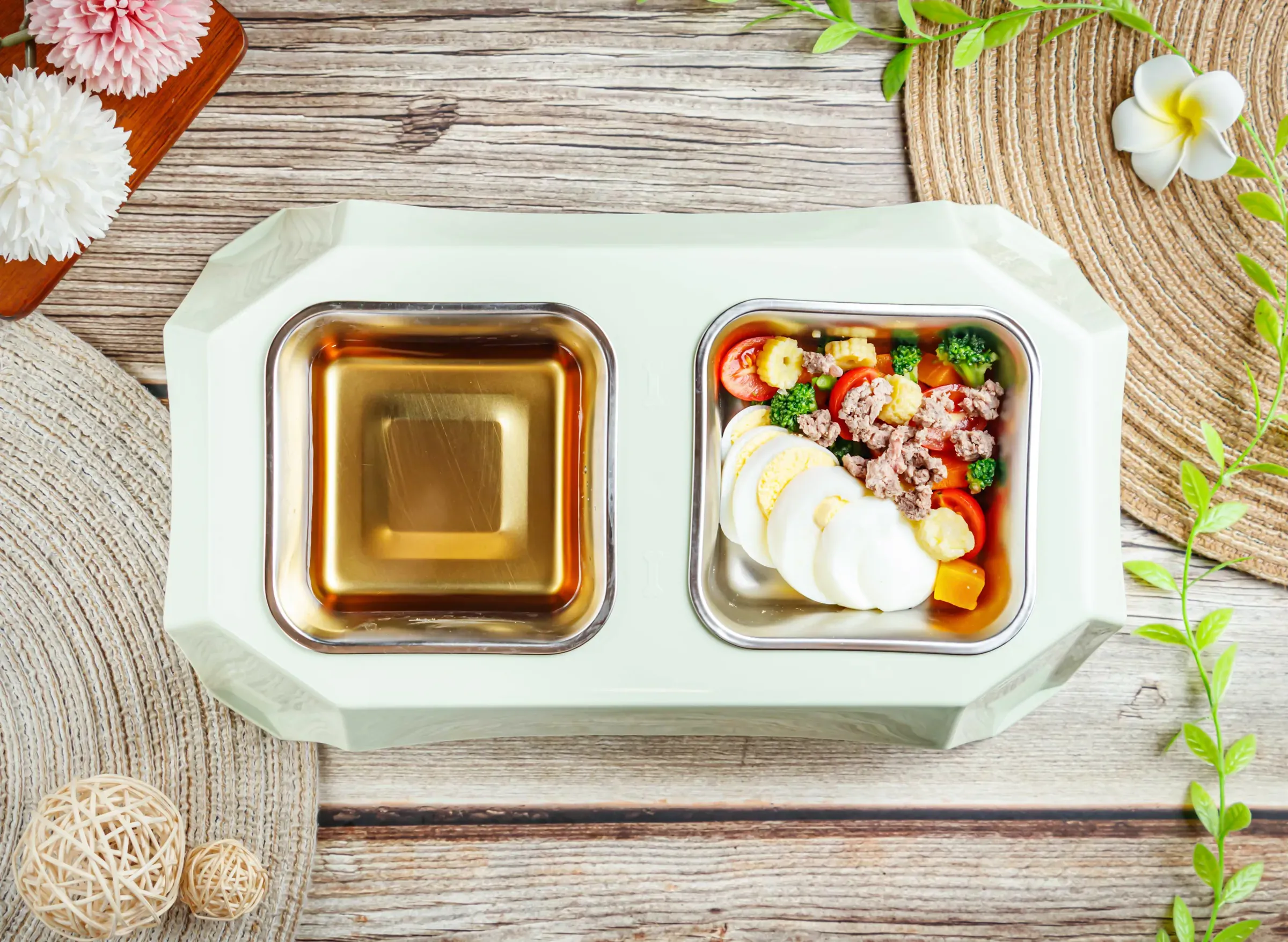 Healthy pet food in a double bowl. Nutritious meal for dog or cat in a modern feeder, dog food & fresh food ecommerce
