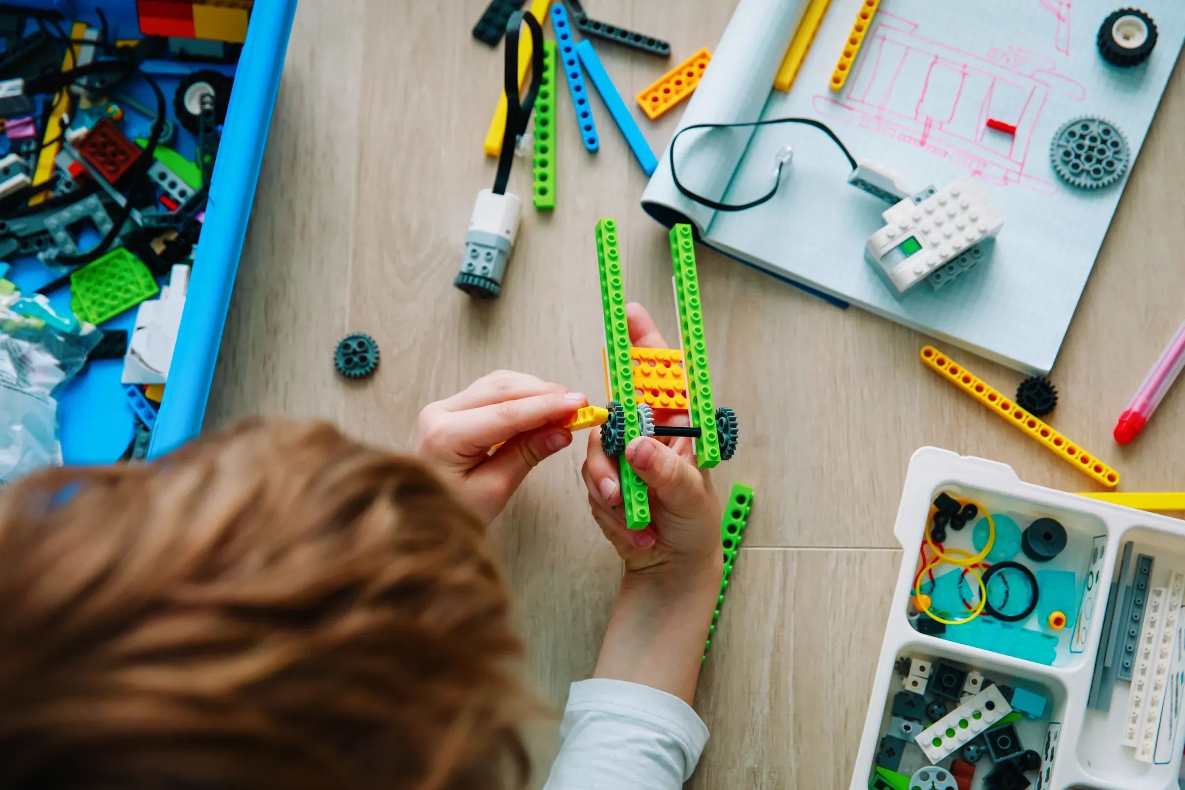 Child building robot at robotic technology school lesson, educational & stem toys ecommerce