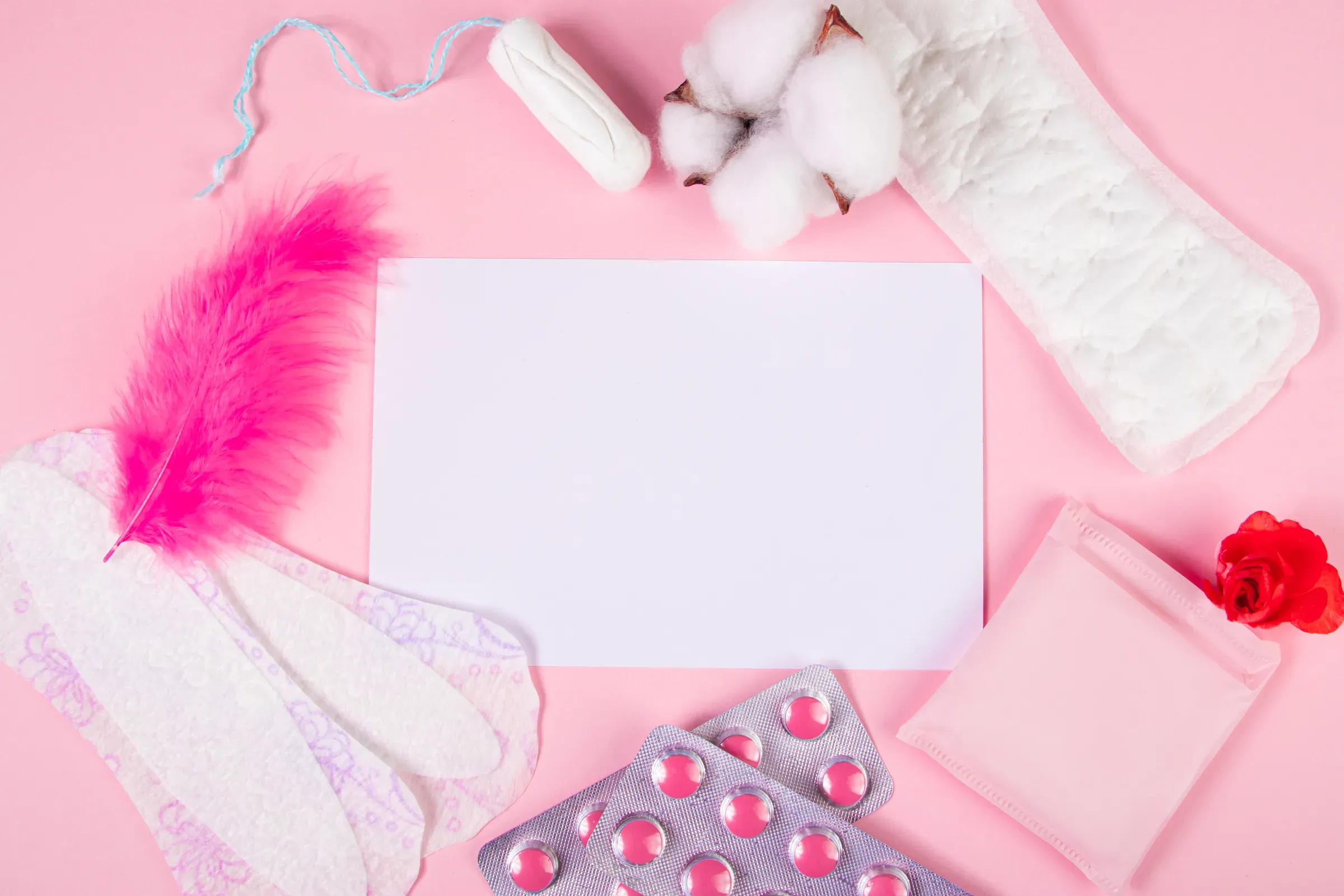 Set of feminine hygiene products for menstruation. Sanitary pads, tampons, pills on pink background, feminine care ecommerce
