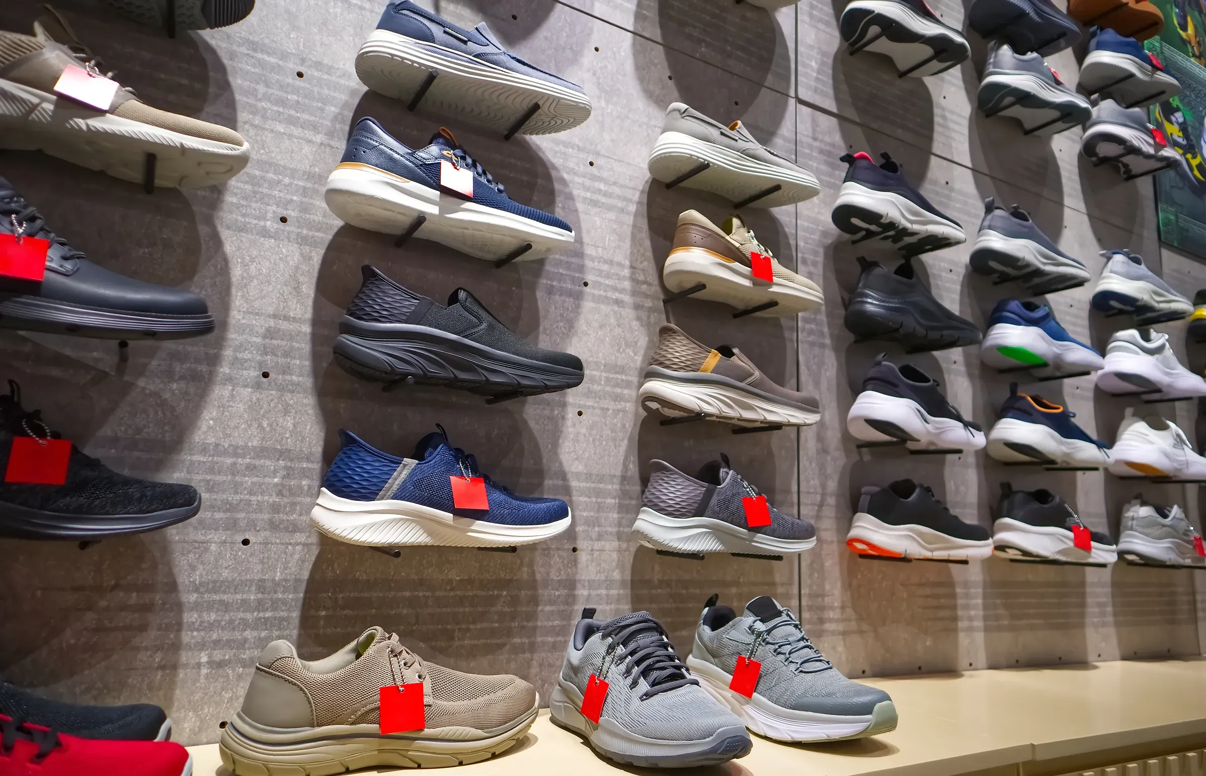 Sneakers on the shelves in the shoe corner in Department Store, Bangkok, Thailand, footwear ecommerce