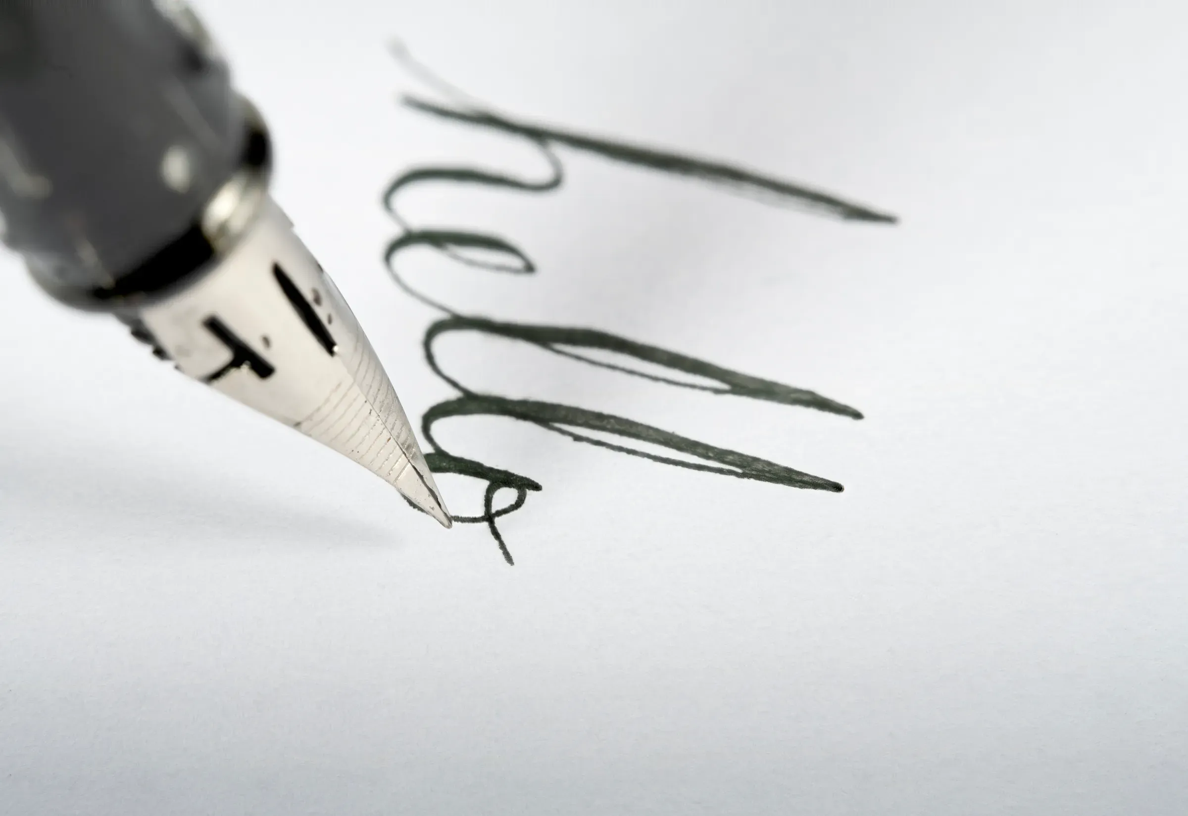 Fountain pen writing hello on white paper, fountain pens & fine writing ecommerce