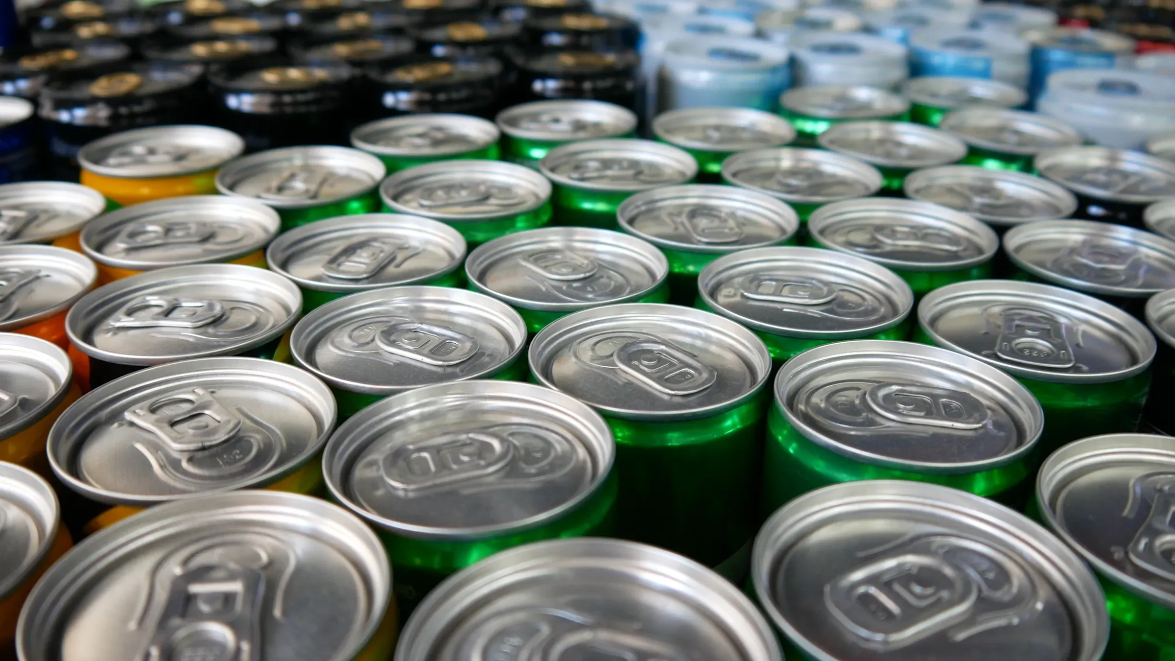 Close-up of many different colorful soda cans, functional beverages & energy ecommerce