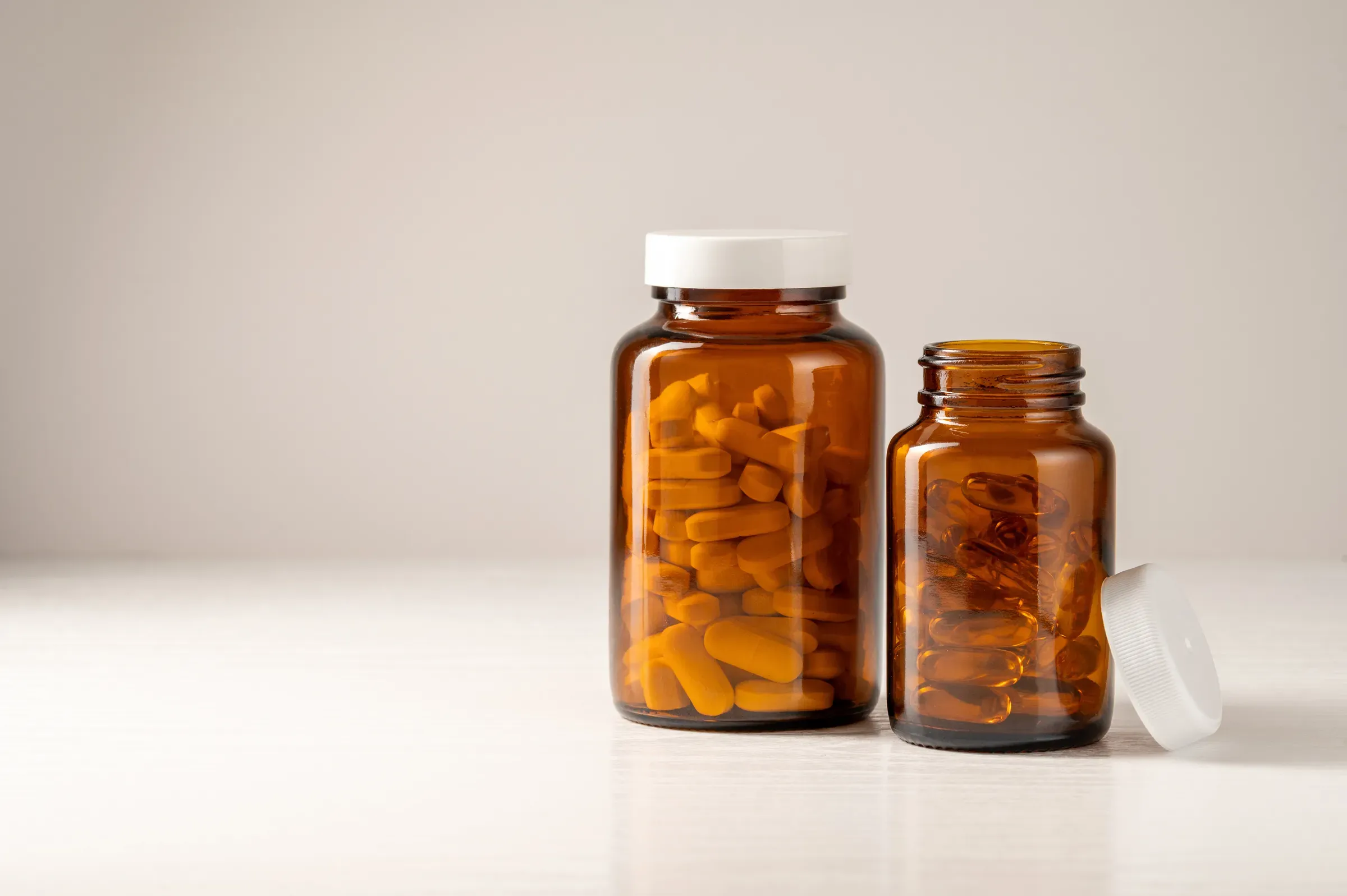 Vitamins, pills, omega 3, food supplements in glass jar, health and wellness. Food supplement, health & wellness ecommerce