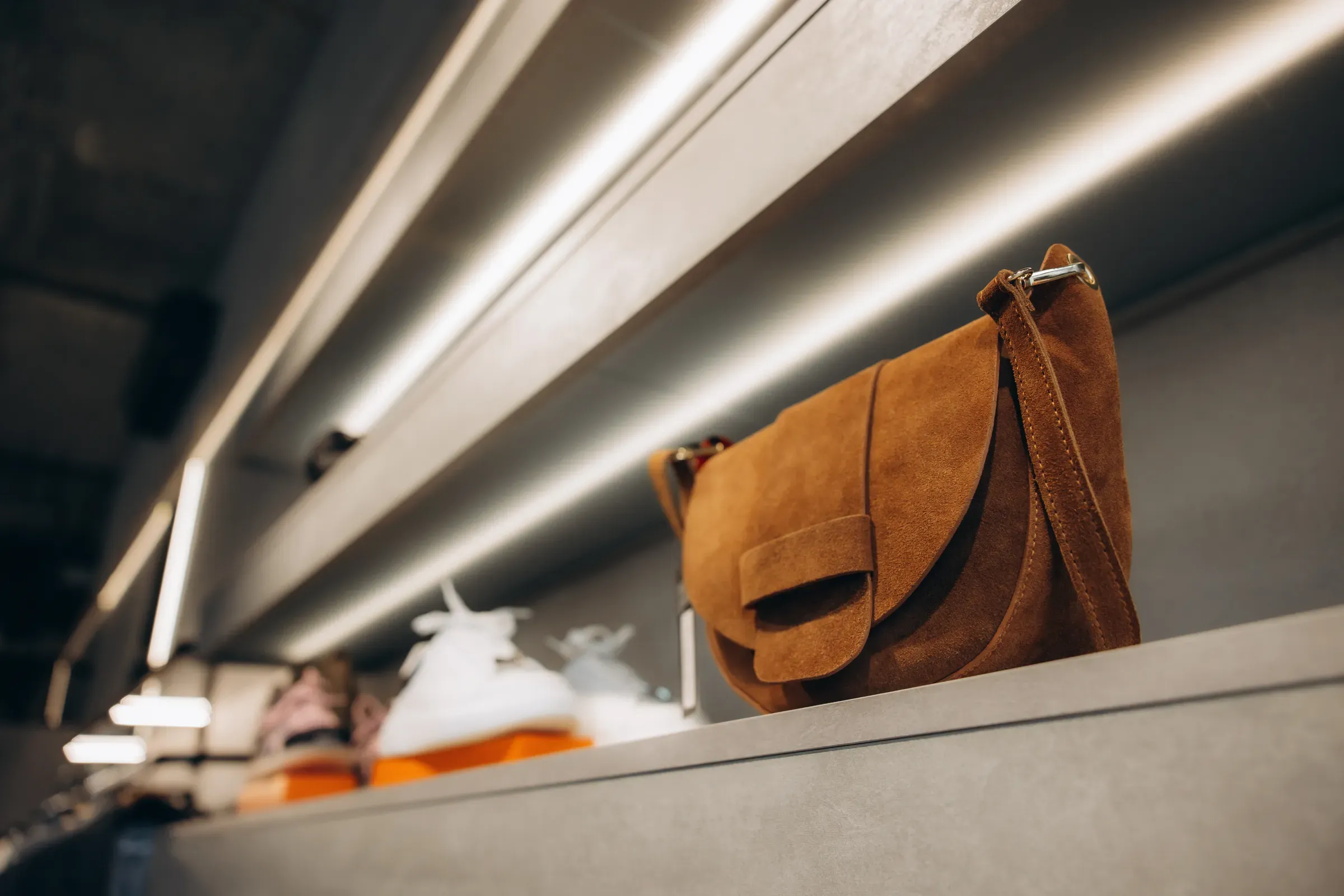 Brown suede handbag displaying in retail boutique store, luxury & premium brands ecommerce