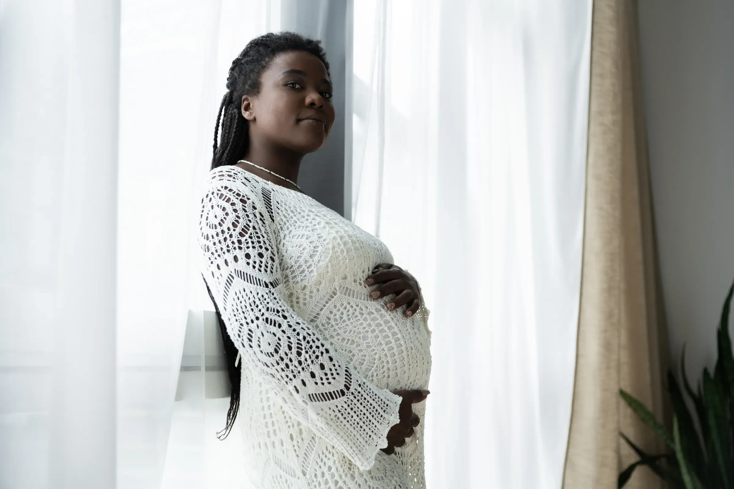 Celebrating motherhood at home with a beautiful pregnant woman and her joy, maternity wear ecommerce