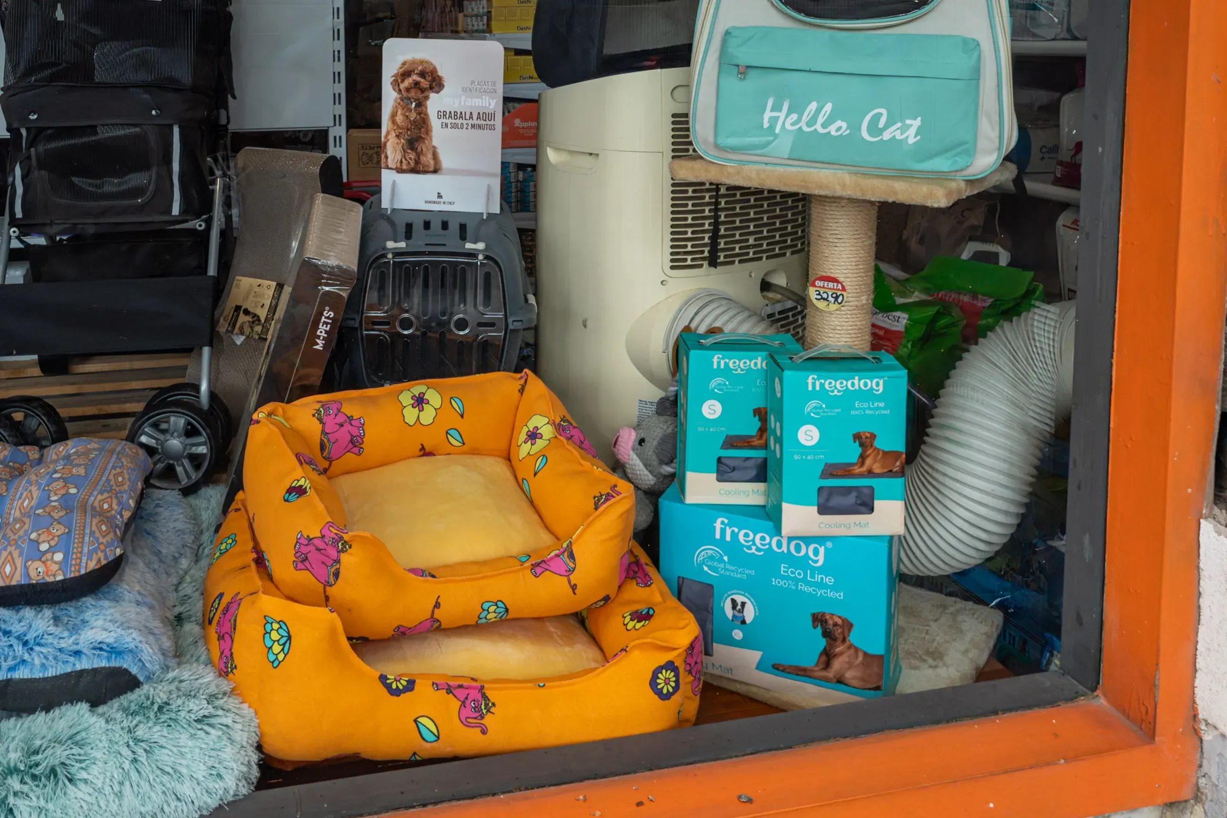 Pet shop window with dog beds and cat supplies, pets ecommerce