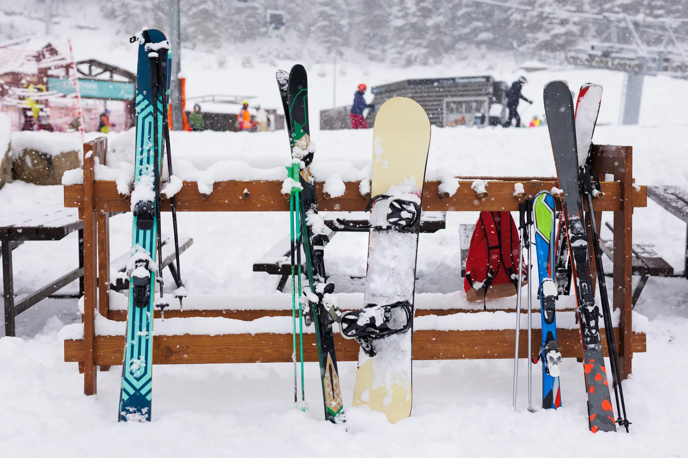 Skis, ski poles and snowboards are fully equipped on snow-covered mountain top during the ski season, ski & snowboard ecommerce