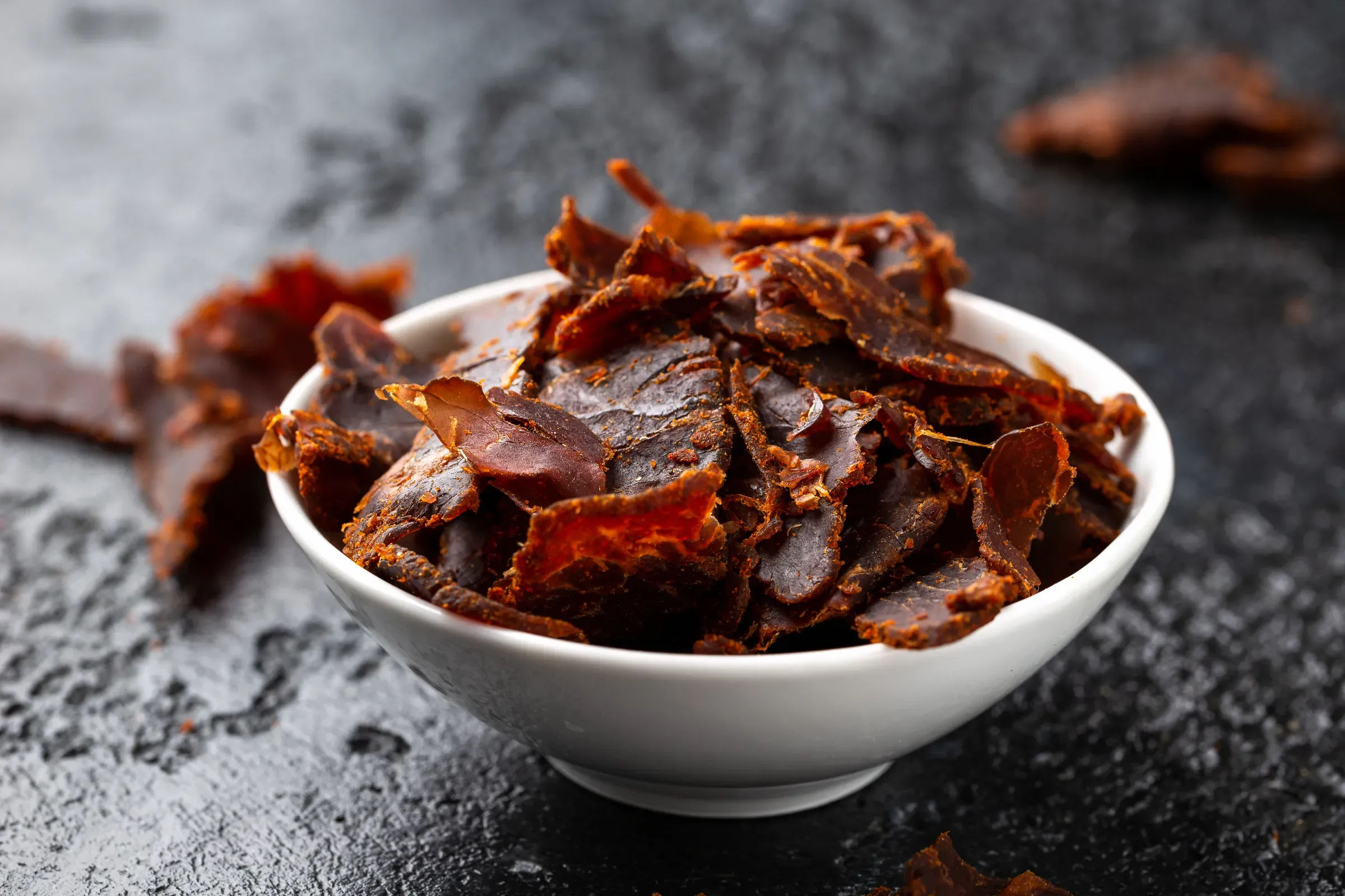 Dried Beef Jerky snack in white bowl, snacks & jerky ecommerce