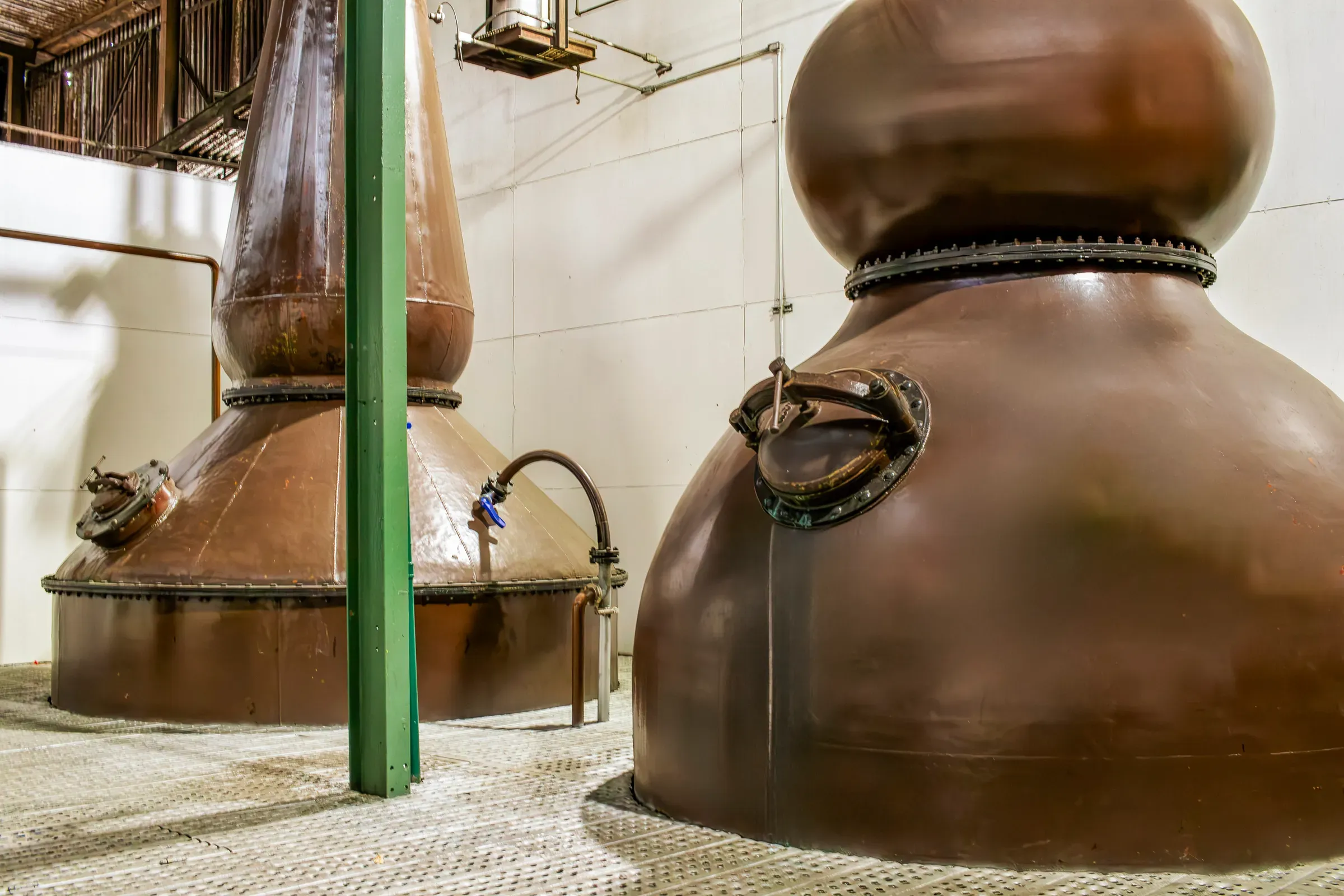 Traditional Copper Pot Stills Inside a Modern Whiskey Distillery, spirits & craft distilleries ecommerce