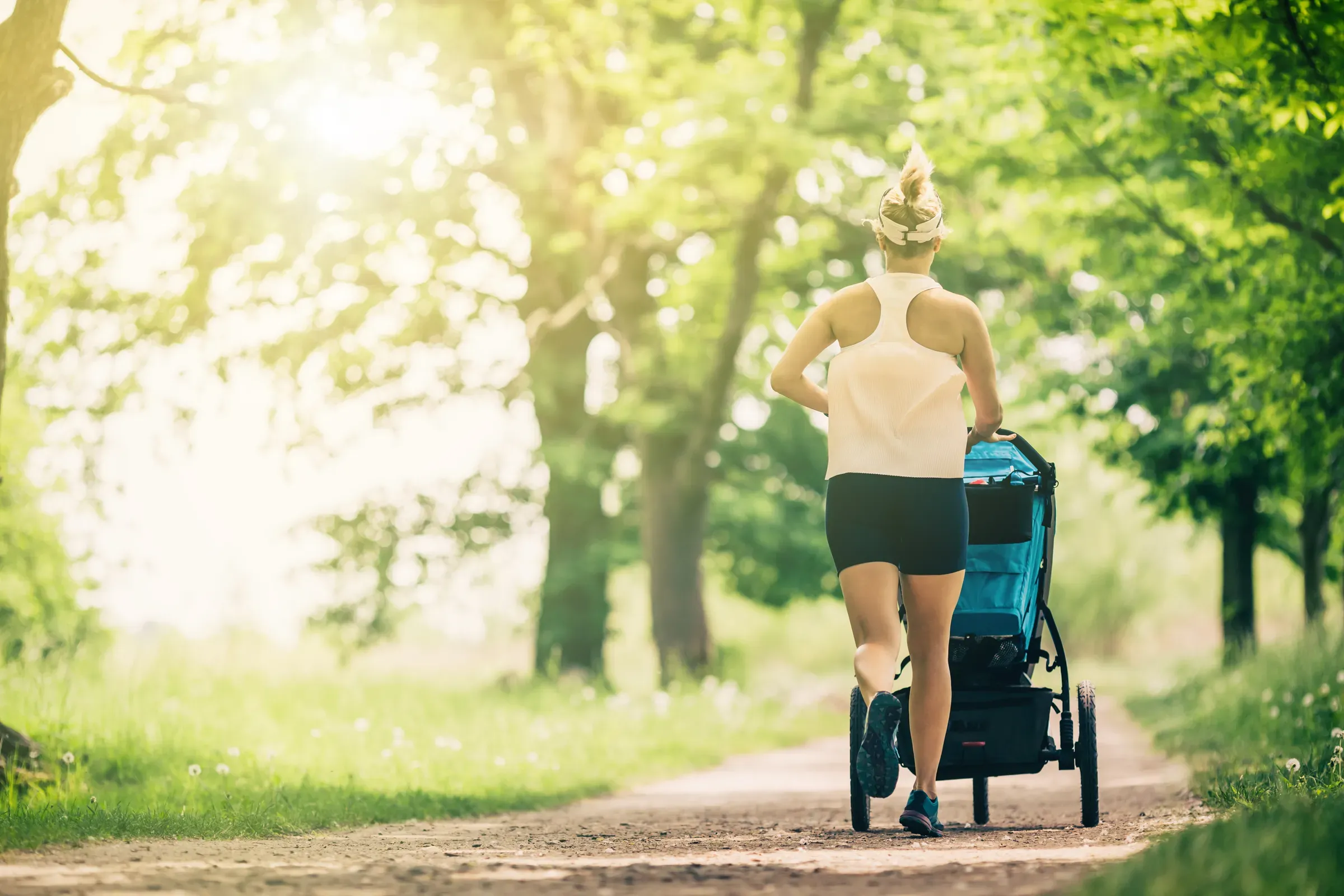 Running woman with baby stroller enjoying summer in park, strollers & car seats ecommerce