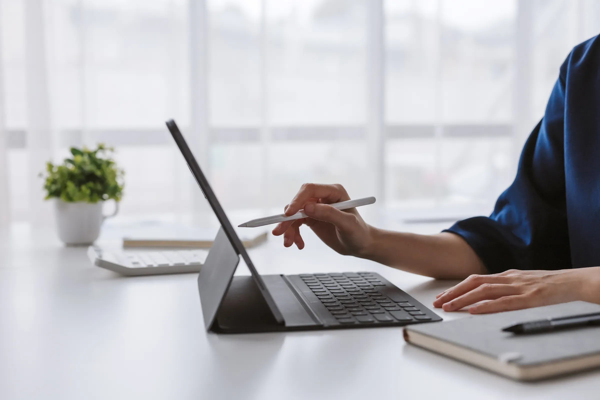 Woman using digital tablet with stylus and keyboard, working in modern office, tablet & e-reader accessories ecommerce