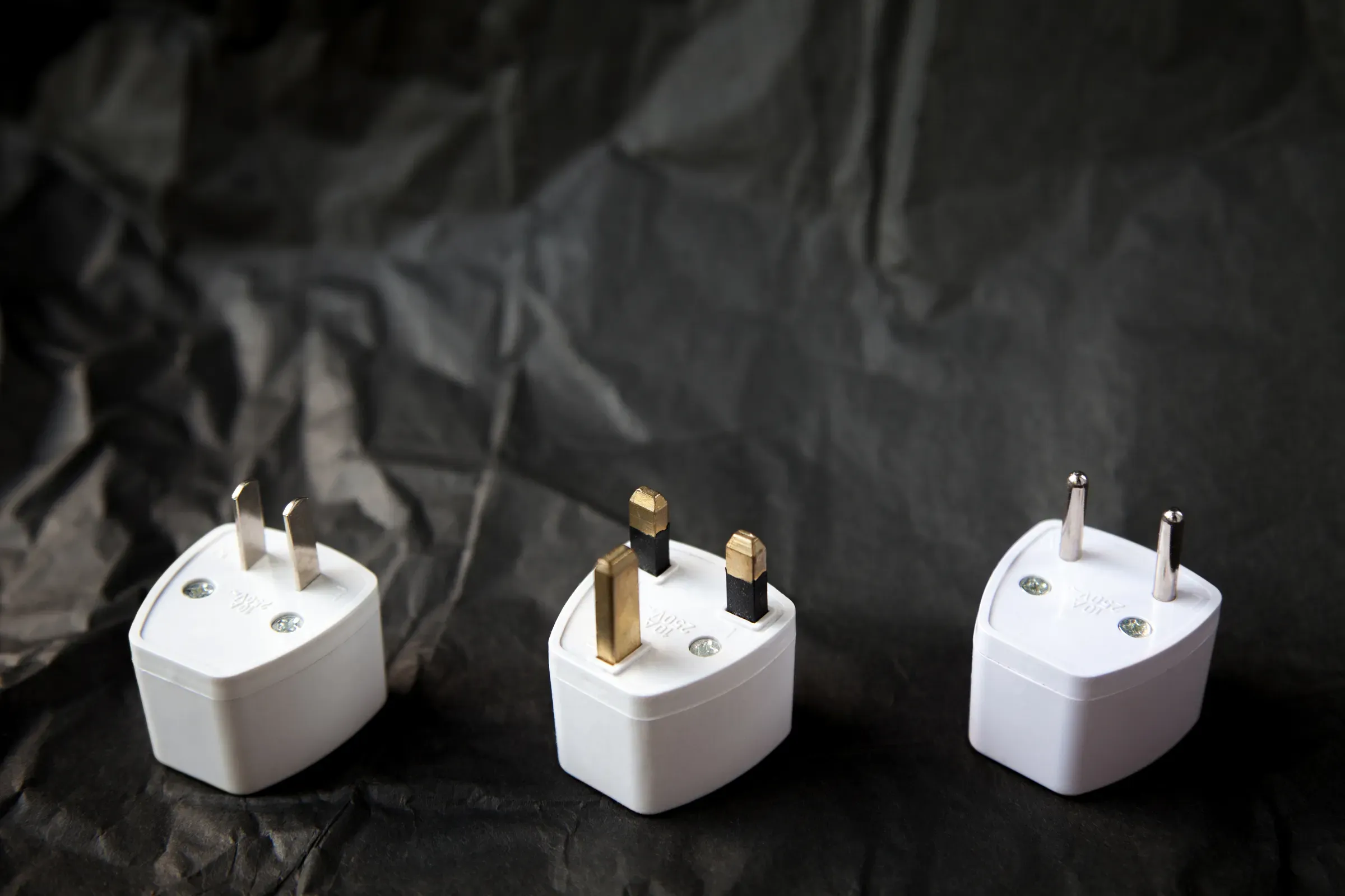 Choosing from various electric plug adapters. Difficulties of traveling, tech travel adapters & chargers ecommerce