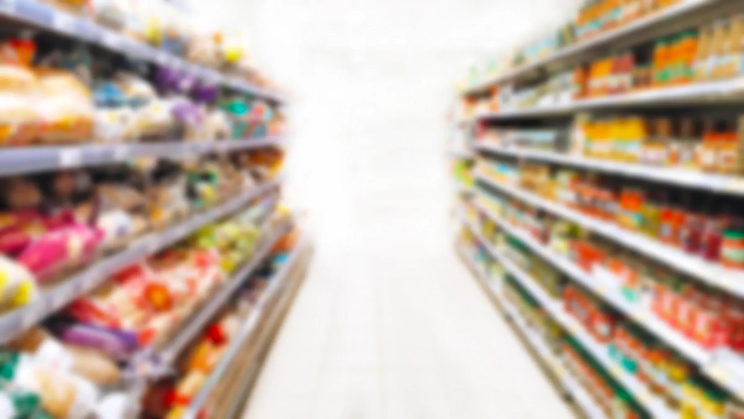 Blur supermarket background. Defocused shelves with products. Grocery store. Retail industry. Discount., value & discount retailers ecommerce